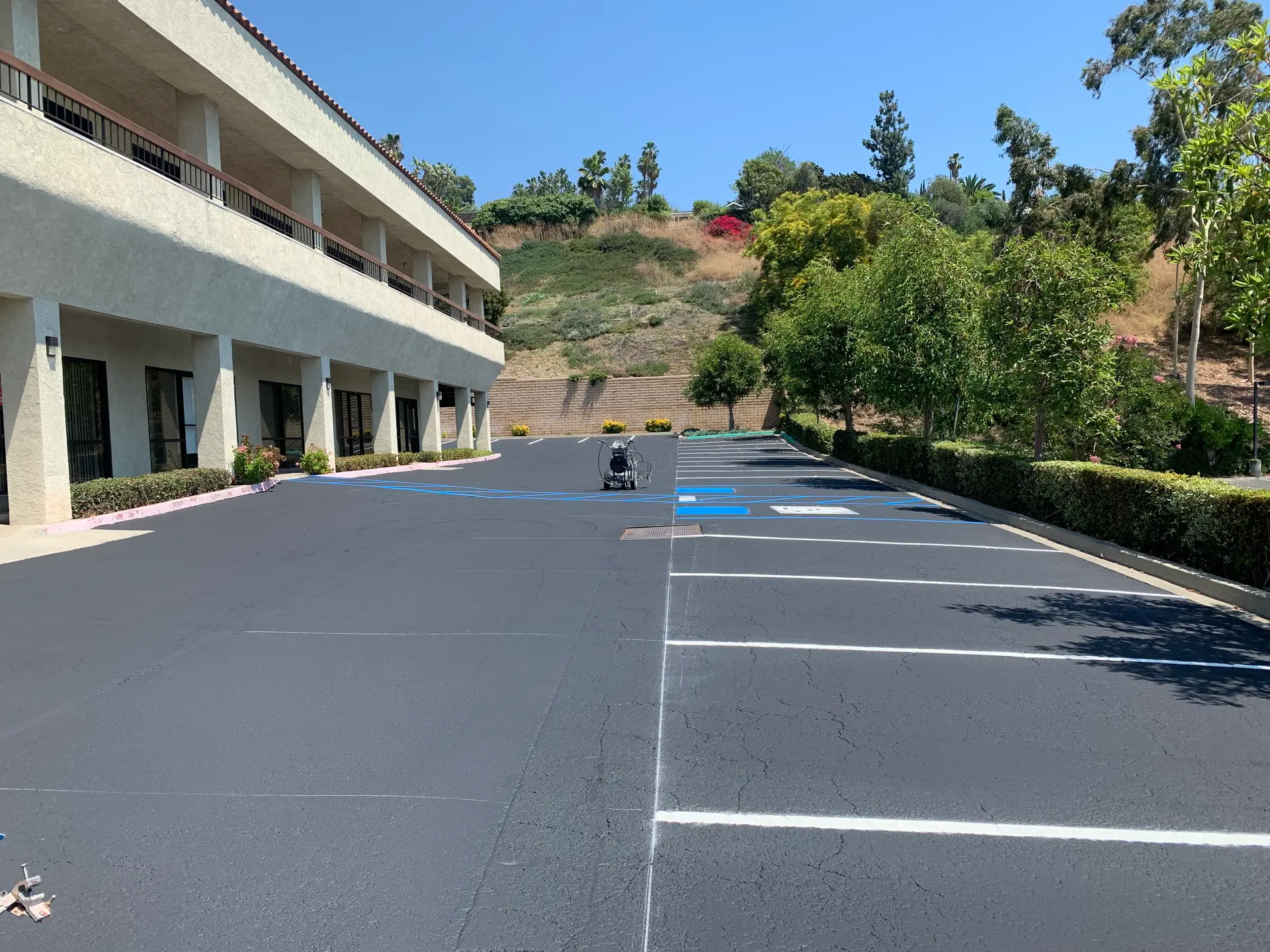 Freshly seal coated commercial lot with fresh striping by Native Union Engineering